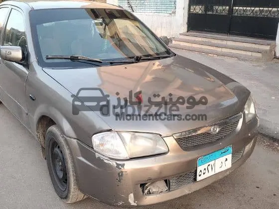 مازدا 323 موديل 2000 دواخل فابريكة ورخصة طويلة للبيع
