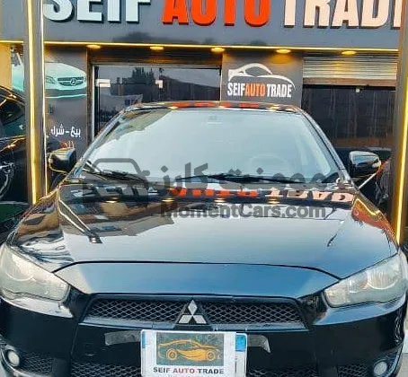 لانسر شارك 2016 فابريكة 140 ألف كم للبيع بالتقسيط