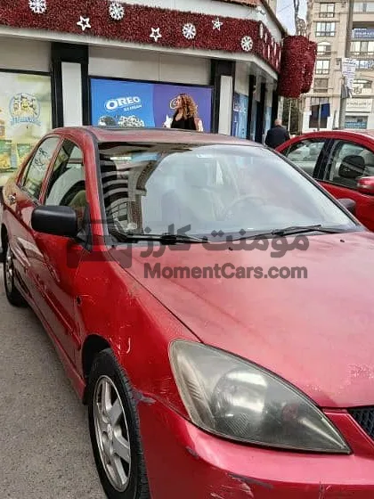 لانسر 2009 اتوماتيك فابريكة برة وجوة للبيع