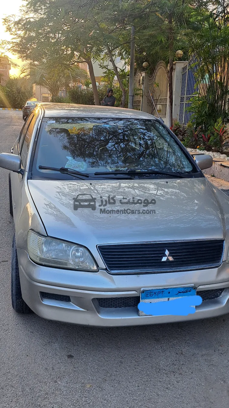 لانسر 2003 اتوماتيك شاشة وجنوط اسبورت